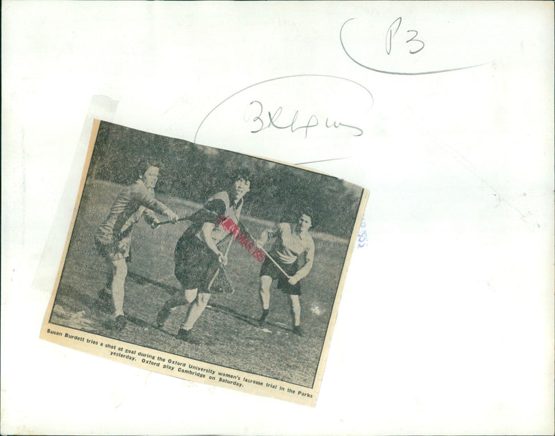 Oxford University women's lacrosse player Susan Burdett takes a shot at goal during a trial match. - Vintage Photograph