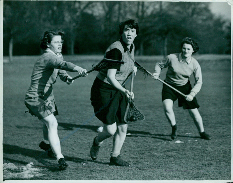 Oxford University women's lacrosse player Susan Burdett takes a shot at goal during a trial match. - Vintage Photograph