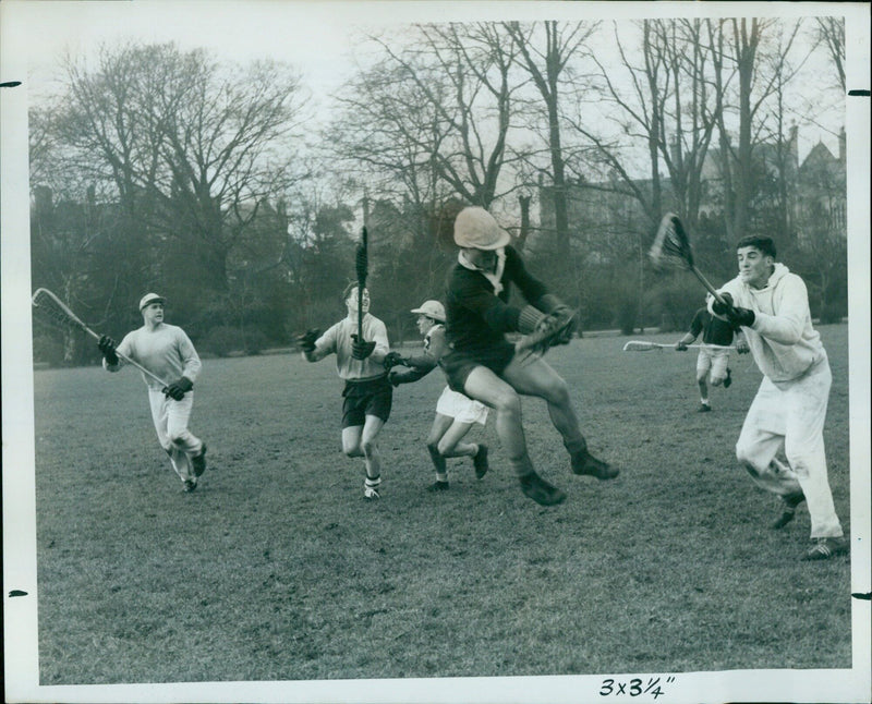 Members of the Oxford University Lacrosse Club practice in the Oxford University Parks. - Vintage Photograph