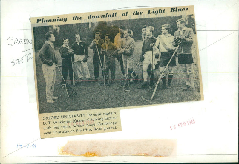 Oxford University lacrosse captain D.T. Wilkinson strategizing with his team. - Vintage Photograph