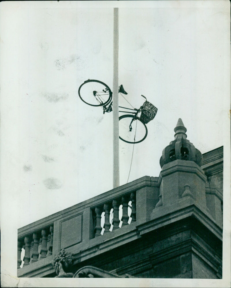 Oxford May Day revelers take over the city streets and waterways during the annual event on Magdalen Bridge. - Vintage Photograph