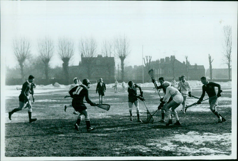 Oxford University takes on Cambridge in a soccer match at Oxford's Gaolmouth stadium. - Vintage Photograph