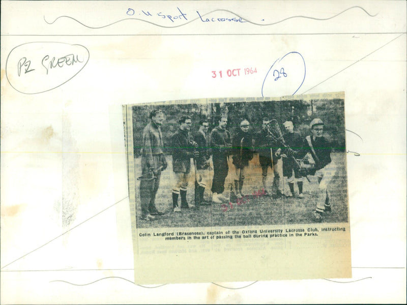 Oxford University Lacrosse Club captain instructs members in the art of passing the ball. - Vintage Photograph