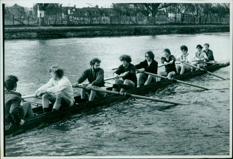 Exeter College 1st eight rowing team practicing on the River Isis ahead of the Torpids rowing race. - Vintage Photograph