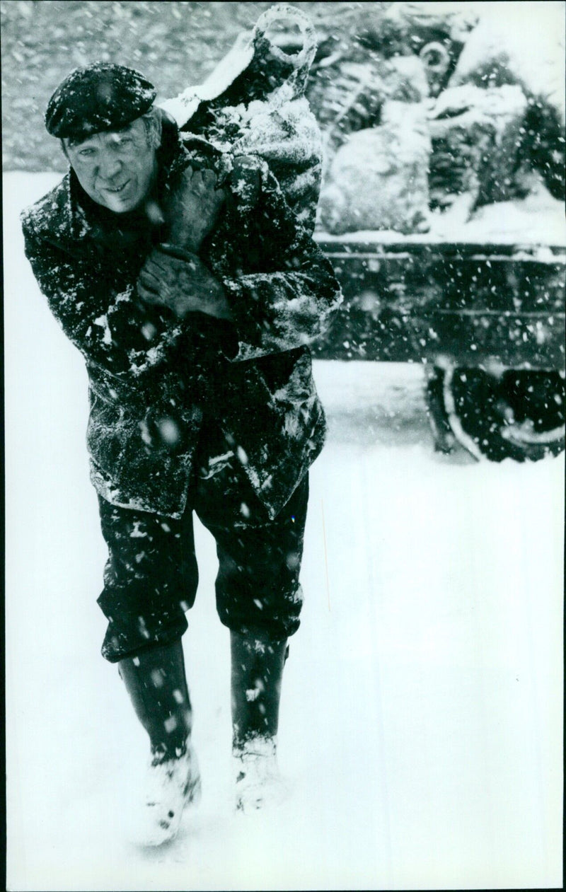 Harold Sed Don, a coal man in Marcham, ensures winter warmth for families. - Vintage Photograph