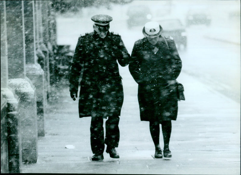 Oxford police officers on patrol in snowy conditions. - Vintage Photograph