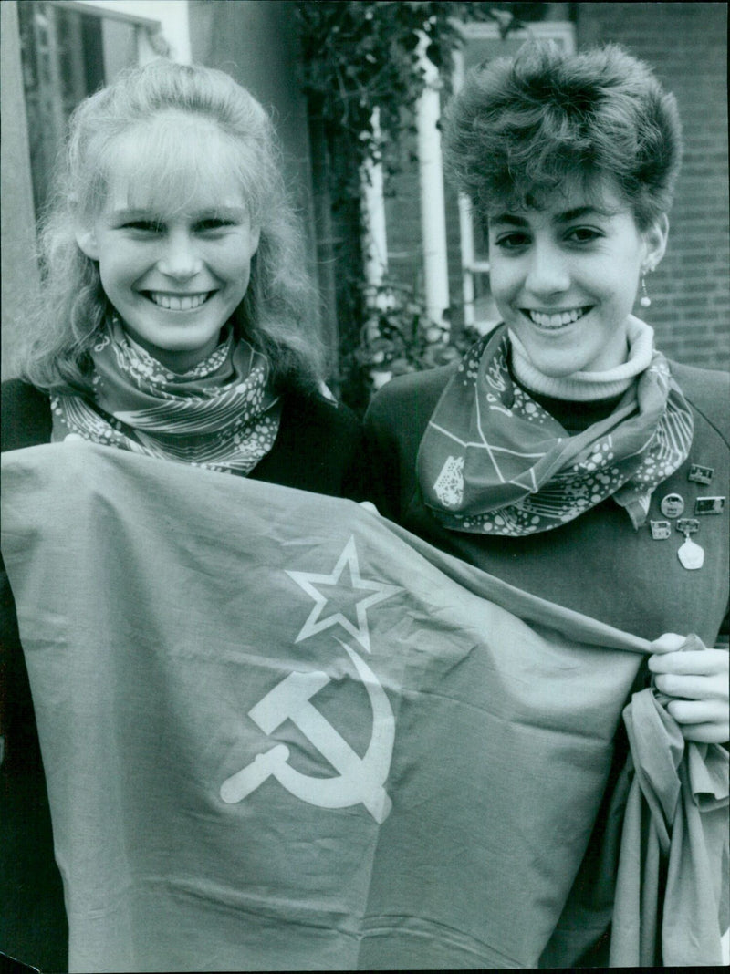 Two schoolgirls, Sally Hayward (left) and Mary Ziegle, show mementos of their trip to the Soviet Union. - Vintage Photograph