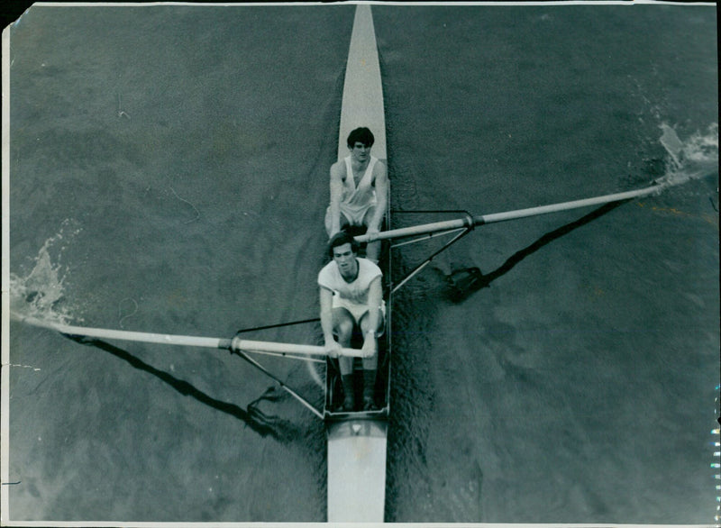 Two members of the Sorcester College rowing team competing in the Oxford University Isis Regatta. - Vintage Photograph