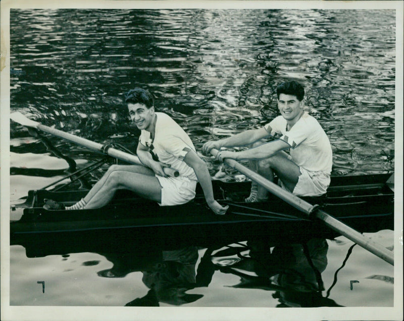 Pembroke College pair celebrate victory in the Oxford University Boat Club challenge pairs on the Isis. - Vintage Photograph