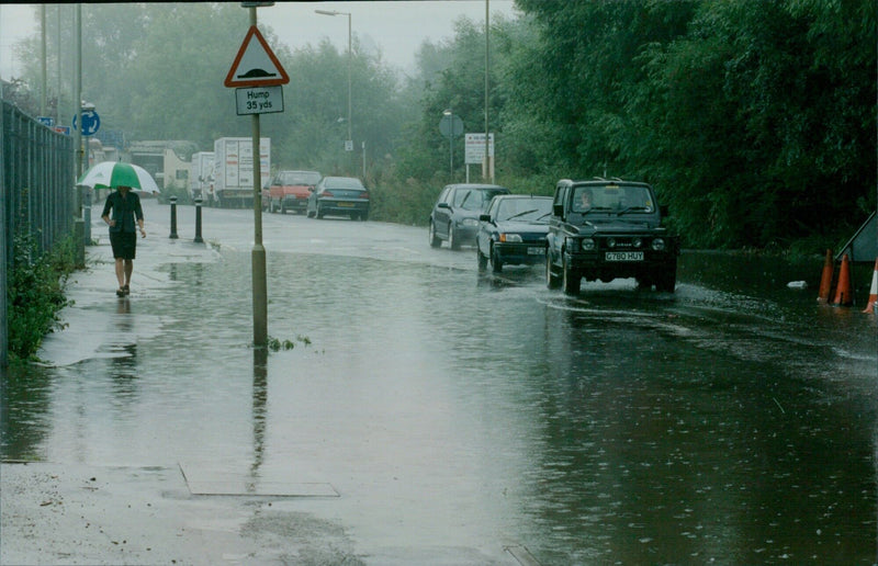 Torrential rain makes walking and driving difficult in Oxford. - Vintage Photograph