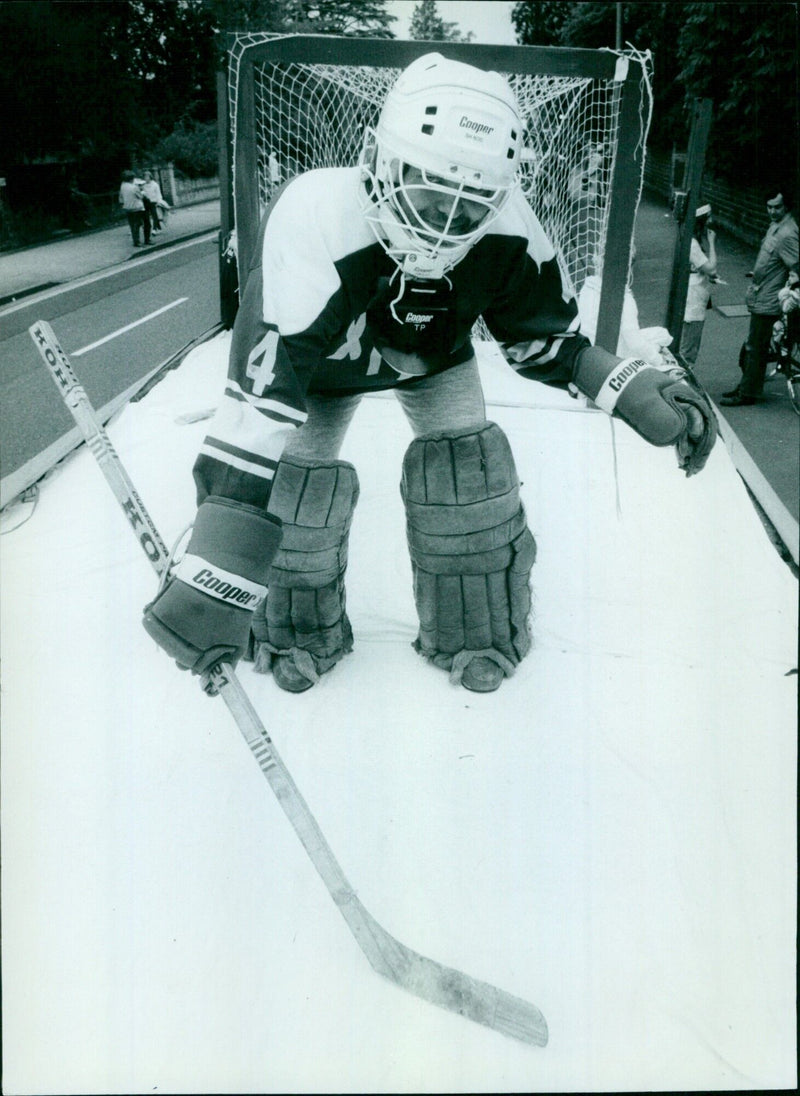 Bill Kennedy, Oxford University goalminder, plays hockey on an ice float. - Vintage Photograph