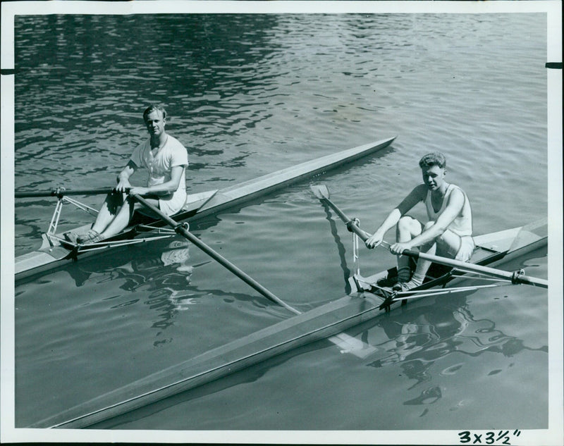 Two rowers compete during the Oxford Men's University Silver Sculls on the Isis. - Vintage Photograph