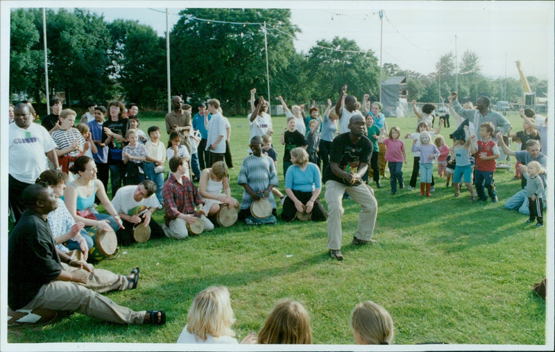 Members of the public and performers celebrate the OOMF finale at South Parks in Oxford. - Vintage Photograph