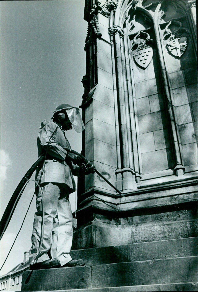 A group of volunteers are seen cleaning the Martyrs' Memorial in Antony Moore on May 3, 2021. - Vintage Photograph