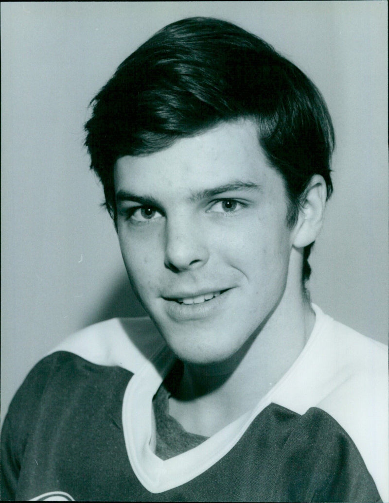 Oxford University Ice Hockey Team player, David D. Merner, prepares to take a shot. - Vintage Photograph