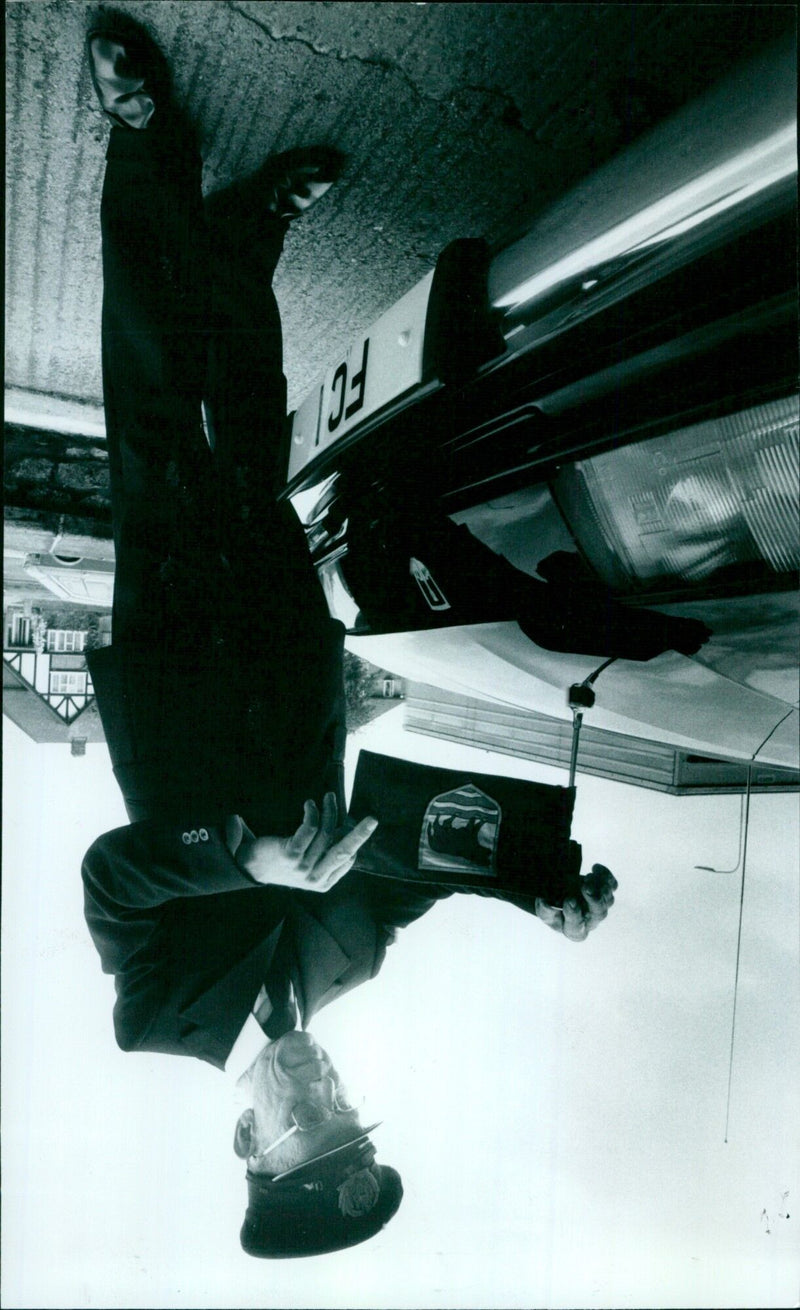 A crowd of people gathered around a car in Oxford, England on May 15th, 1978. - Vintage Photograph