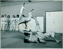 Two judo athletes competing at the 2020 Tokyo Olympic Games. - Vintage Photograph