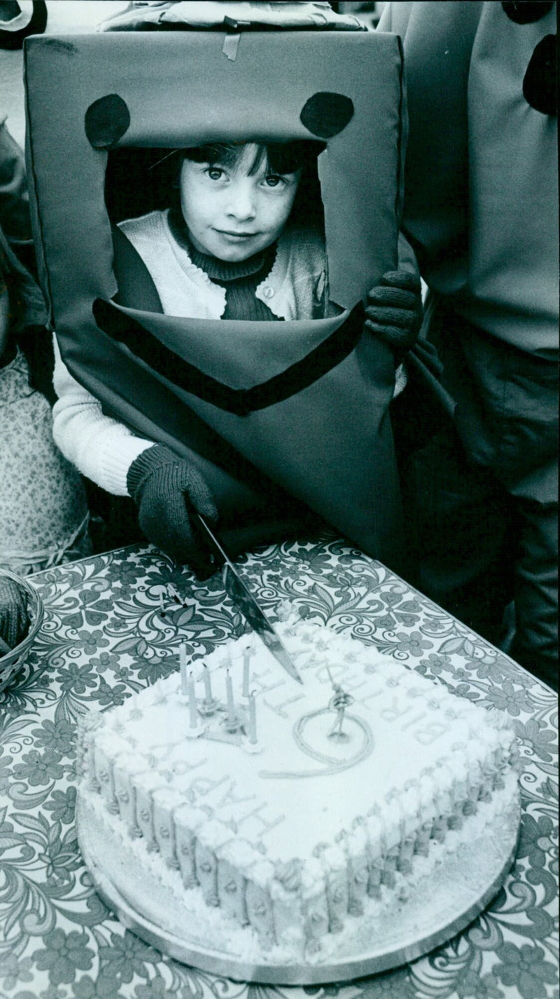 Danielle Clark celebrates her sixth birthday on the St. Michael's School float. - Vintage Photograph