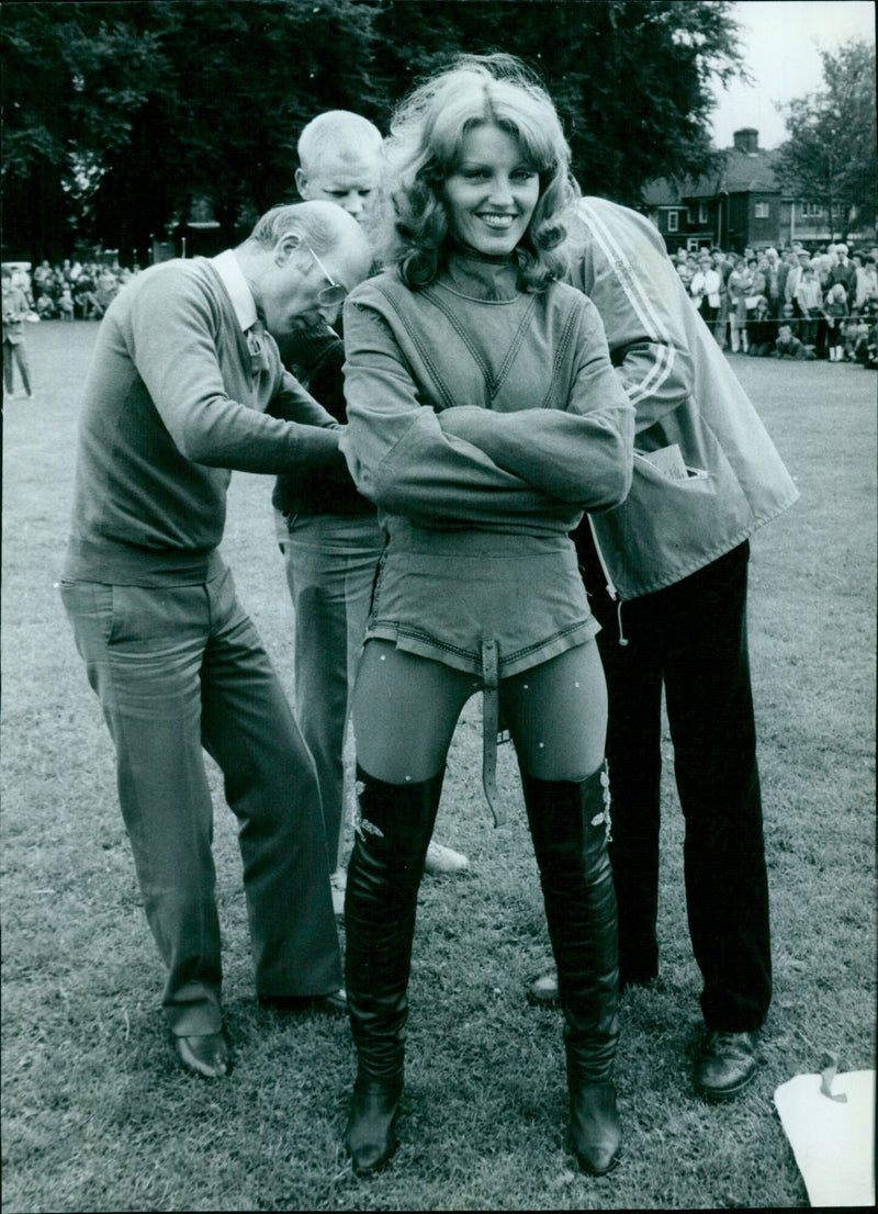 Actress Gale Gordon gets prepared for a hoist on set. - Vintage Photograph