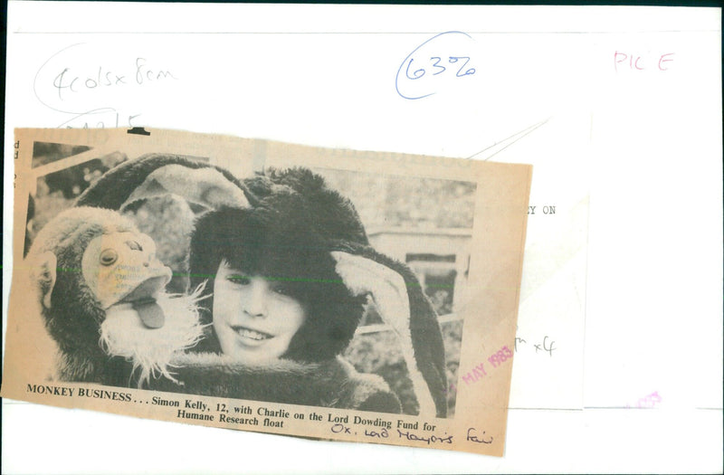 Simon Kelly, 12, rides a float with a monkey named Charlie at the Mayor's Fair in Oxford. - Vintage Photograph