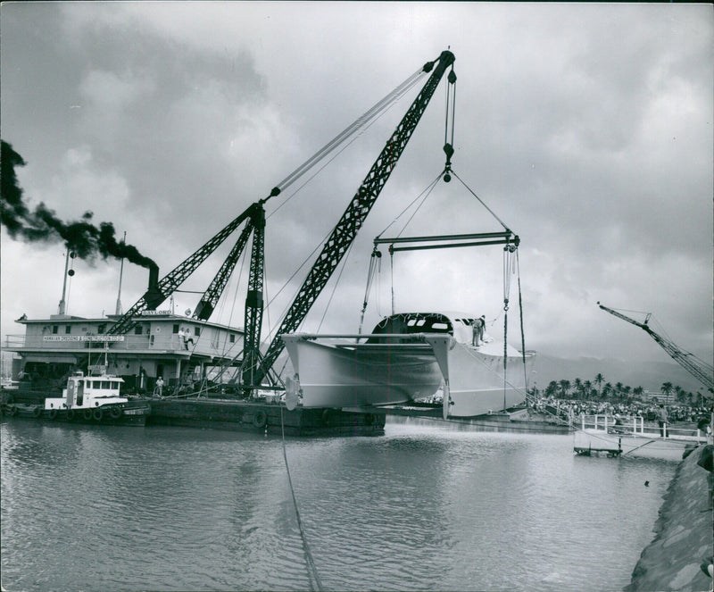 Employees of the Hawaiian Dredging & Construction Company work on a project in Honolulu, Hawaii on July 25, 1960. - Vintage Photograph