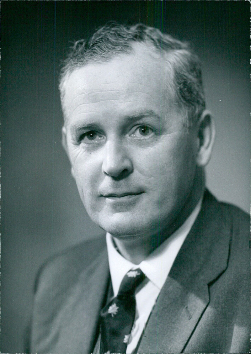 On October 21st, Director of Shipbuilding Employers' Federation, N.A. Sloan Q.C., is pictured in his office in Torsgate. He assumed his current position in 1953 and is married with two sons and one daughter. - Vintage Photograph