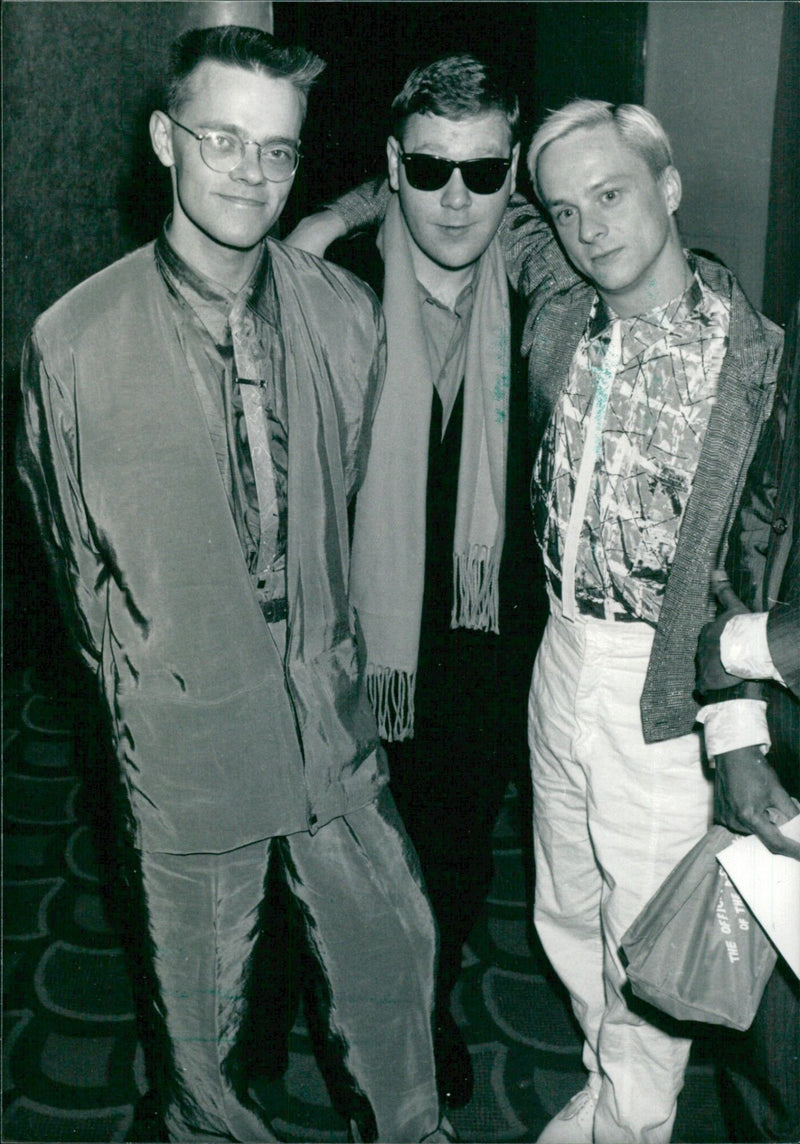 John Foster (right), Larry Steinbachek (left), and Steve Bronski of the British pop group Bronski Beat pose together in 1985. The newly-formed trio had chart success with "Hit That Beat Boy" and "Come On, Come On". - Vintage Photograph