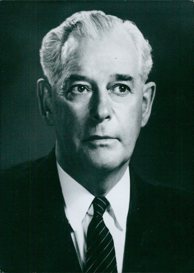 New Zealand Prime Minister Keith Holyoake and Deputy Leader of the Opposition pose for a portrait by photographer Ronald Woolf. - Vintage Photograph