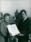 1967 Films and Filming Honours Miss Olivia de Havilland in "The Adventurers" with co-stars Bekim Fehmiu and Candice Bergen. - Vintage Photograph