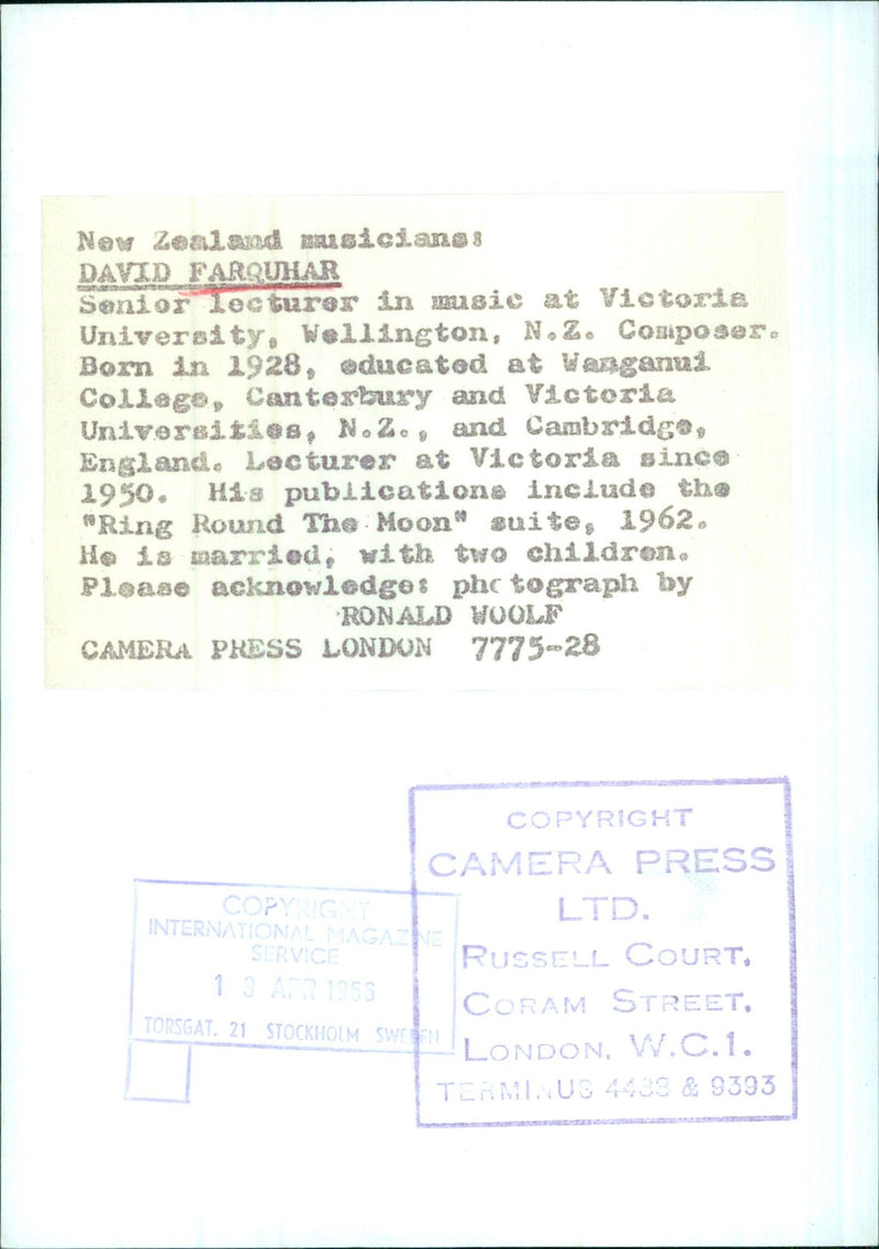 David Farquhar, Senior Lecturer in Music at Victoria University in Wellington, New Zealand, poses with a copy of his publication "Ring Round the Moon" in 1956. - Vintage Photograph