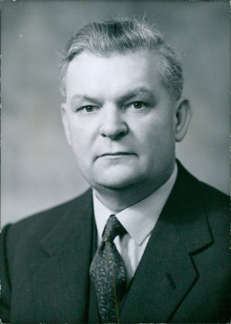 Sir Ronald Gould, General Secretary of the National Union of Teachers, poses for a portrait study by Bassano. - Vintage Photograph