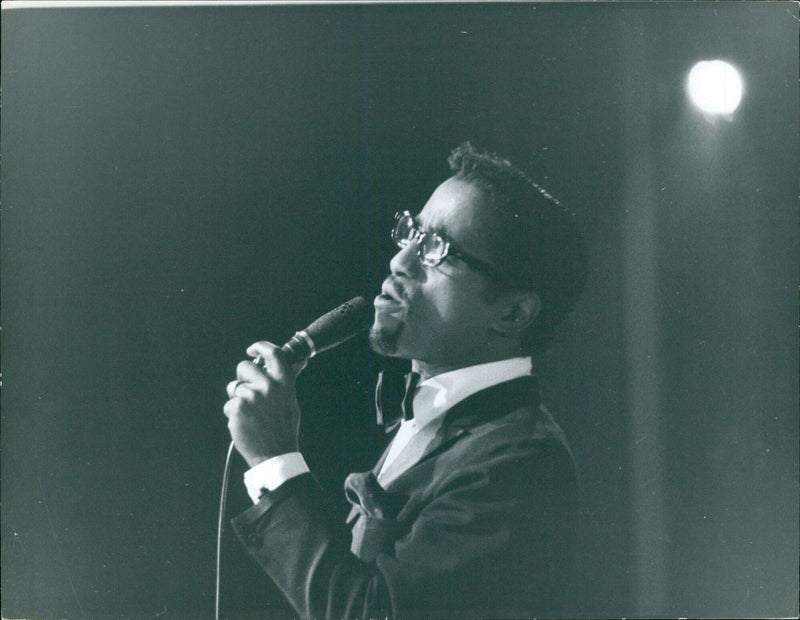 Sammy Davis Jr. is seen attending the Torsgat event in Stockholm, Sweden on September 26, 1961. - Vintage Photograph