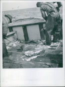In this 1945 photo, a woman is seen walking past a destroyed building in Stockholm, Sweden. - Vintage Photograph