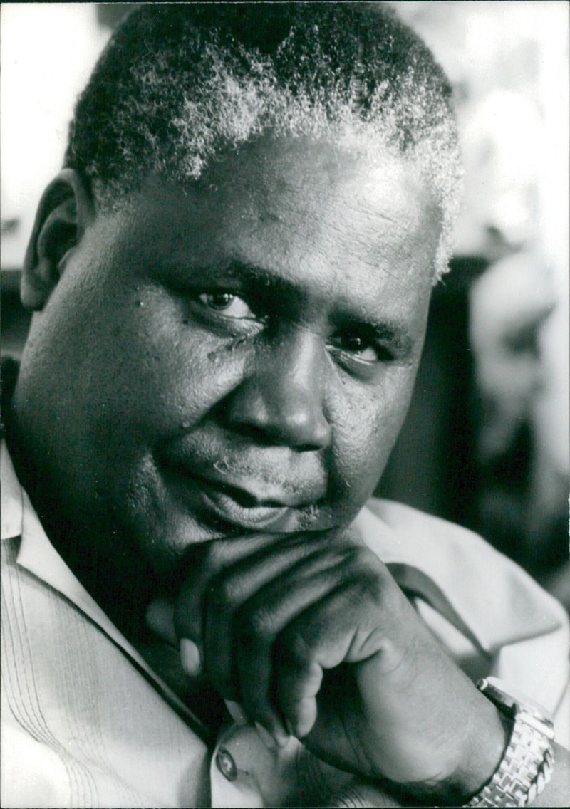 JOSHUA NKOMO, the most effective spokesman for the black Rhodesian community and leader of the African National Council (ANC), is seen in December 1975 engaging in constitutional talks with then Prime Minister Ian Smith. - Vintage Photograph