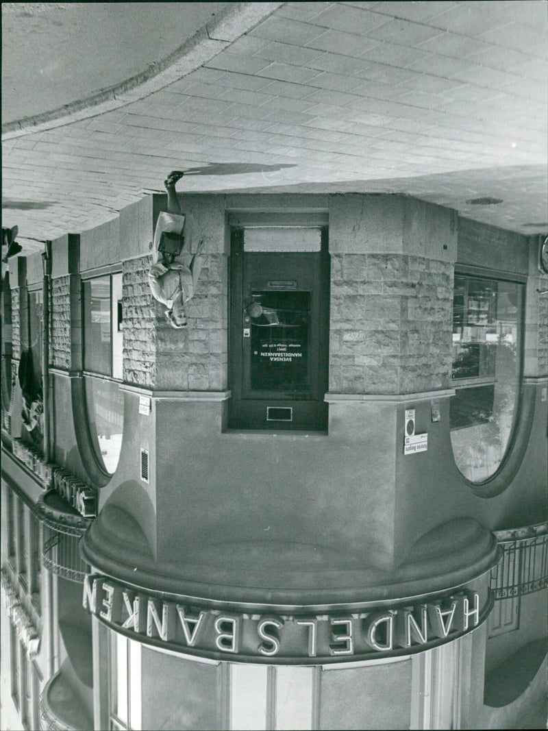 Customers line up outside of the Svenska Handelsbanken store on Latarina Bangata 20 in Stockholm, Sweden. - Vintage Photograph