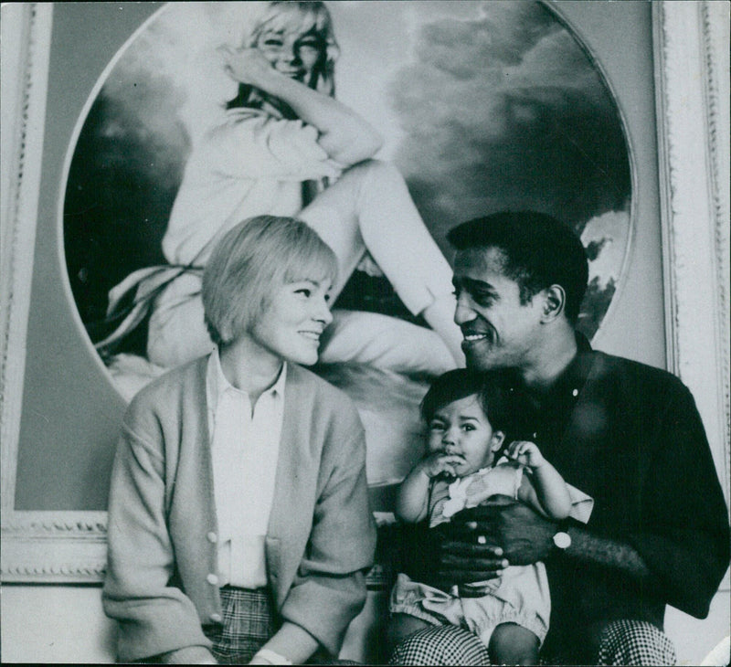 A woman stands in front of a painting while visiting the L Magazine Service in Stockholm, Sweden. - Vintage Photograph