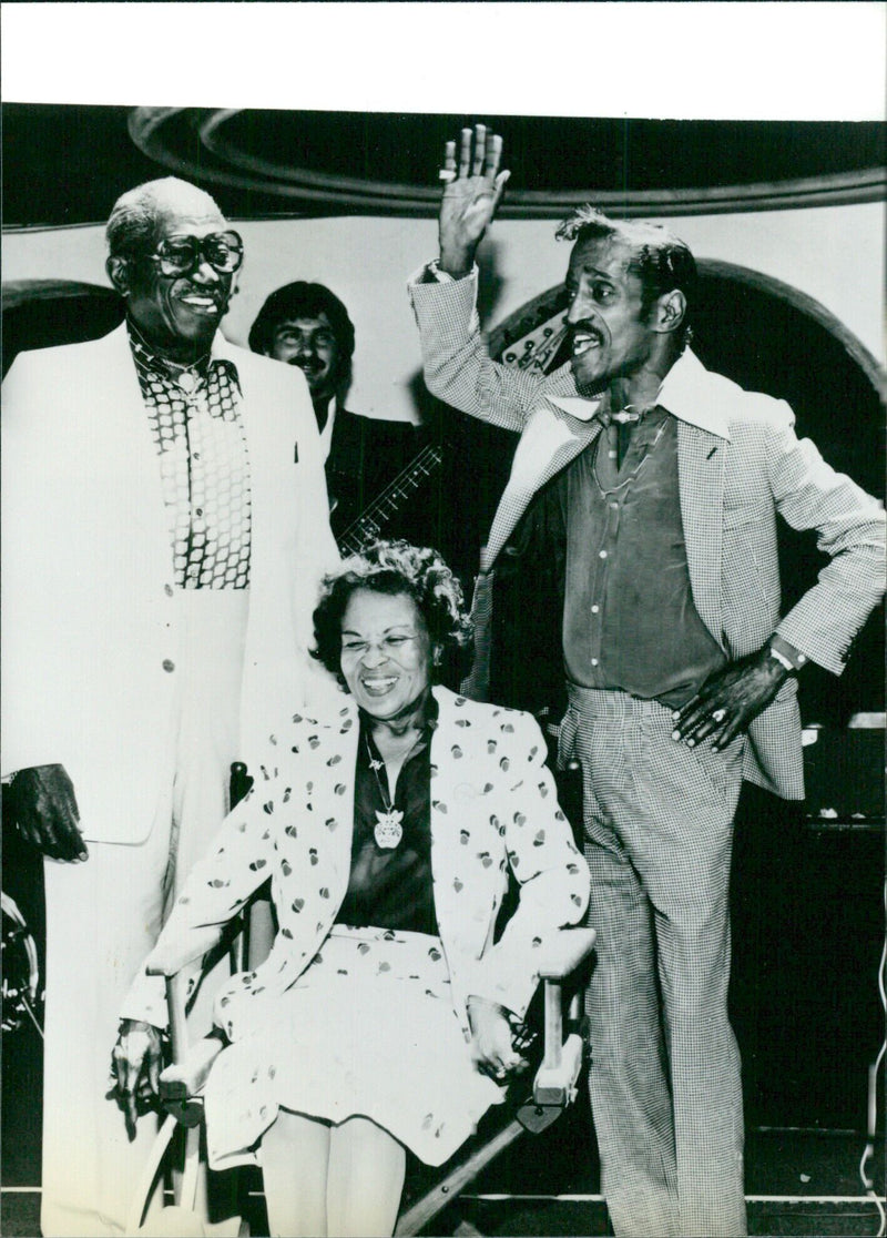 U.S. entertainer Sammy Davis Jr. celebrates 50 years in show business with his parents, Sammy Davis Sr. and an unidentified woman, in 1980. - Vintage Photograph