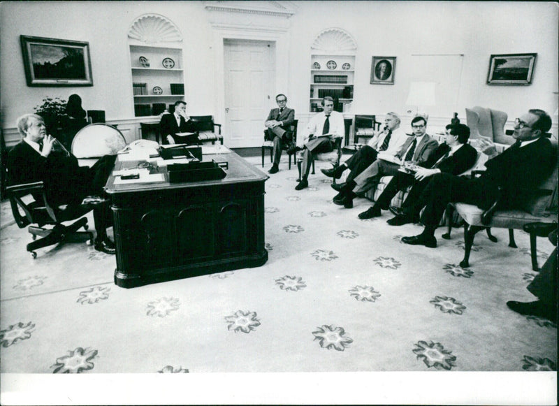 President Jimmy Carter holds a meeting with members of his Cabinet at the White House to discuss grave matters of state. - Vintage Photograph