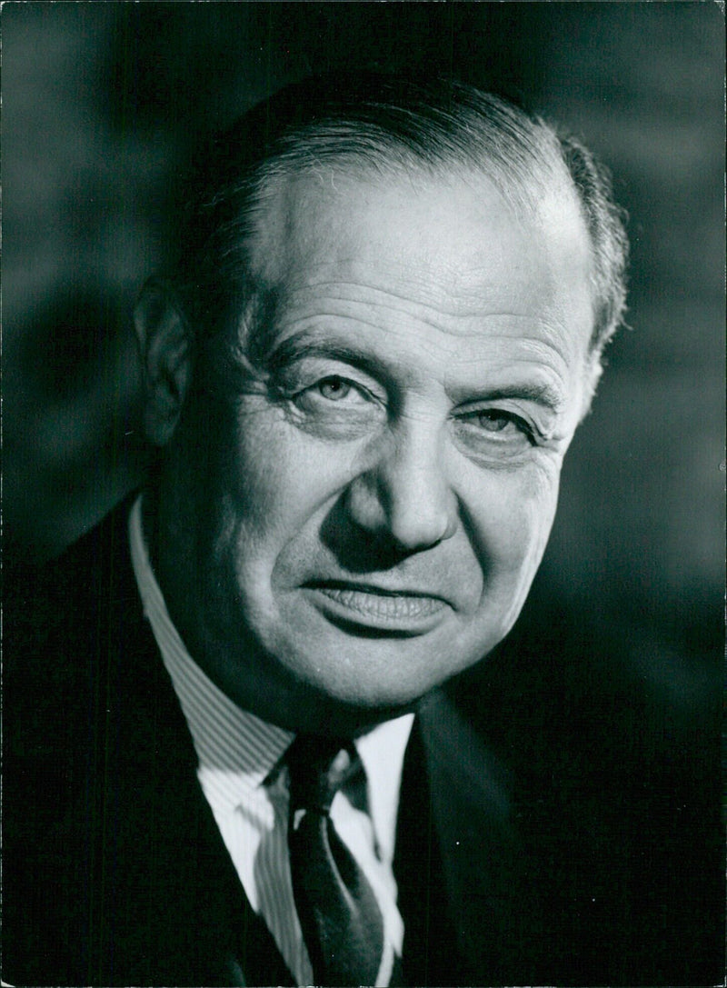 British businessman Sir Rex Conen poses for a portrait taken by photographer Walter Bird in Stockholm, Sweden. - Vintage Photograph