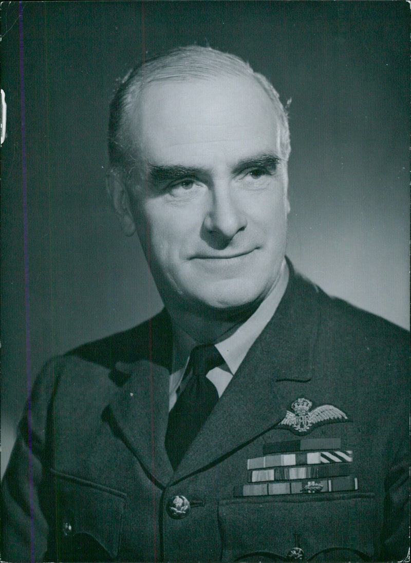 Air Marshal Sir Hugh Walmsley, Air Officer Commanding Flying Training Command, poses for a portrait. - Vintage Photograph