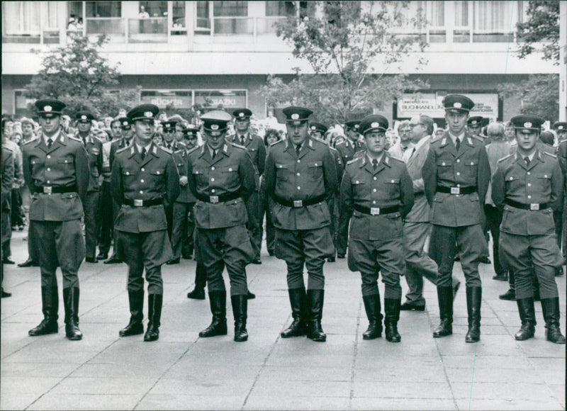 East German police are on duty in Leipzig during mass demonstrations in September 1989, prompted by Hungary's decision to lift border restrictions, leading to thousands of East Germans crossing to the West. - Vintage Photograph