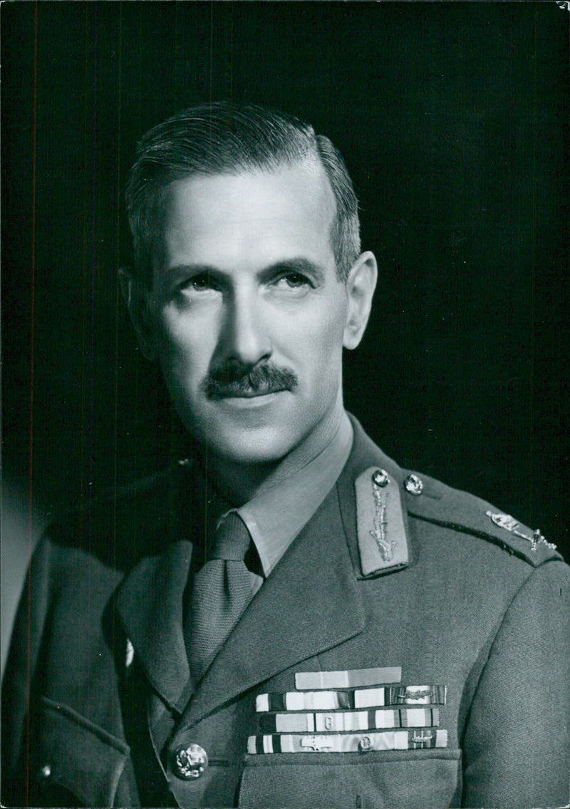 General Sir Sidney Kirkman, Director General of Civil Defence, is captured in a portrait study by Bassano. Copyright Camera Press Ltd. - Vintage Photograph