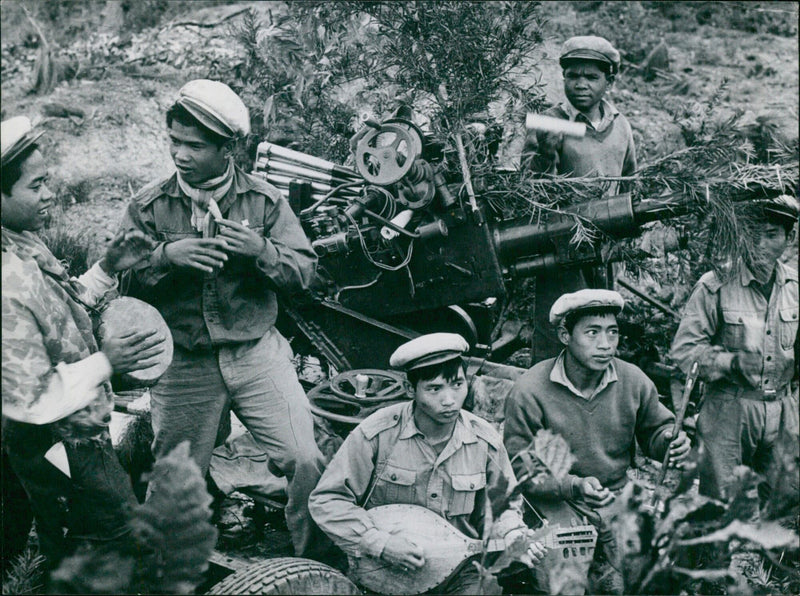 Anti-aircraft troops of the Laotian Peoples' Liberation Army are seen in Laos, where fighting continues despite the 1962 Geneva Agreement. - Vintage Photograph