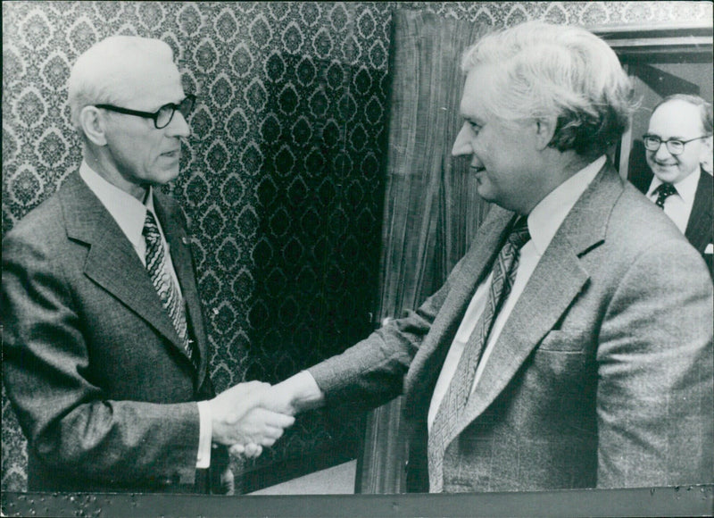 East German Prime Minister Willi Stoph greets Britain's Secretary of Stats for Trade Edmund Dell during the latter's 1977 visit to East Germany. - Vintage Photograph