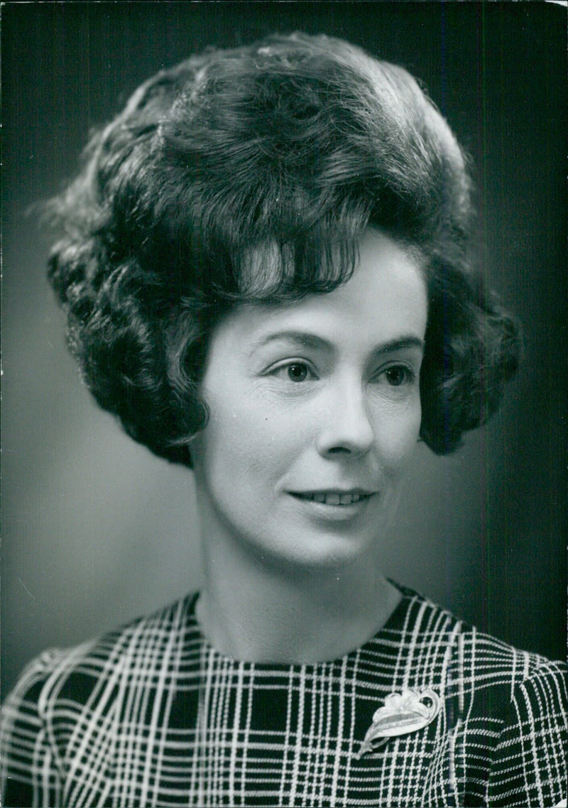 Miss D.M. Otter, headmistress of the Royal School for daughters of officers of the Royal Navy and Royal Marines, poses for a photograph at Haslemere in September 1970. - Vintage Photograph