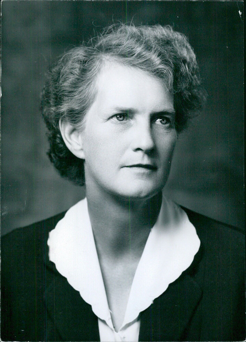 Dame Evelyn Sharp, the first woman Civil servant in Britain to be appointed Permanent Secretary to the Ministry of Housing and Local Government, poses for a portrait study photographed by Bassano. - Vintage Photograph