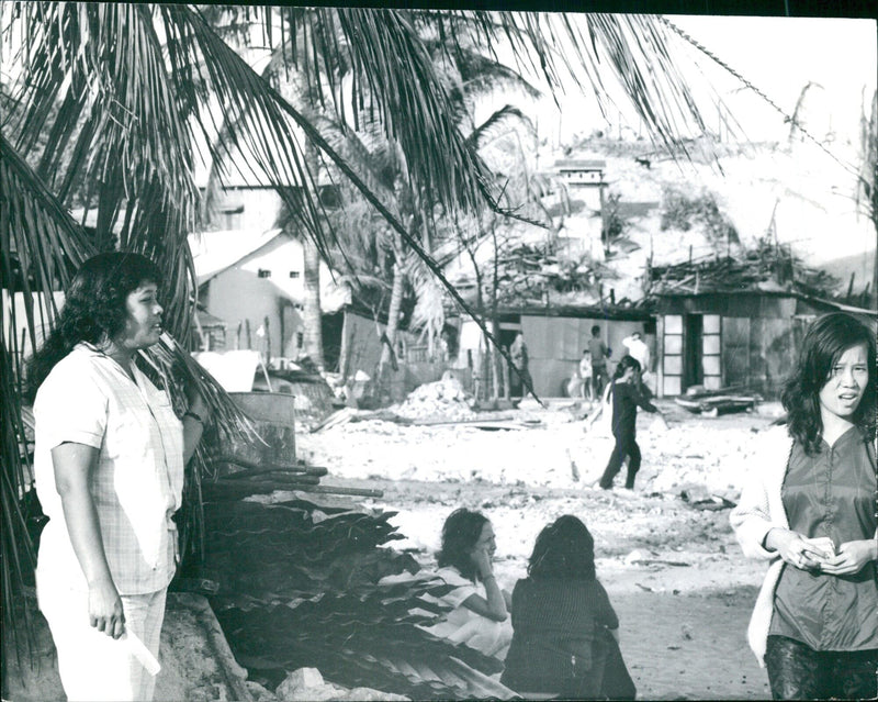 Local residents of Ranh, Vietnam, standing in front of the 6805470 TOSCAT dam on 21 May 2021. - Vintage Photograph