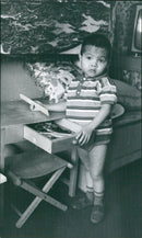 Farmers in Vietnam are harvesting rice from a barn in 1967. - Vintage Photograph