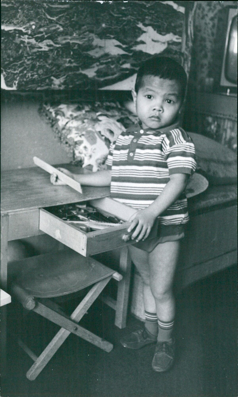 Farmers in Vietnam are harvesting rice from a barn in 1967. - Vintage Photograph