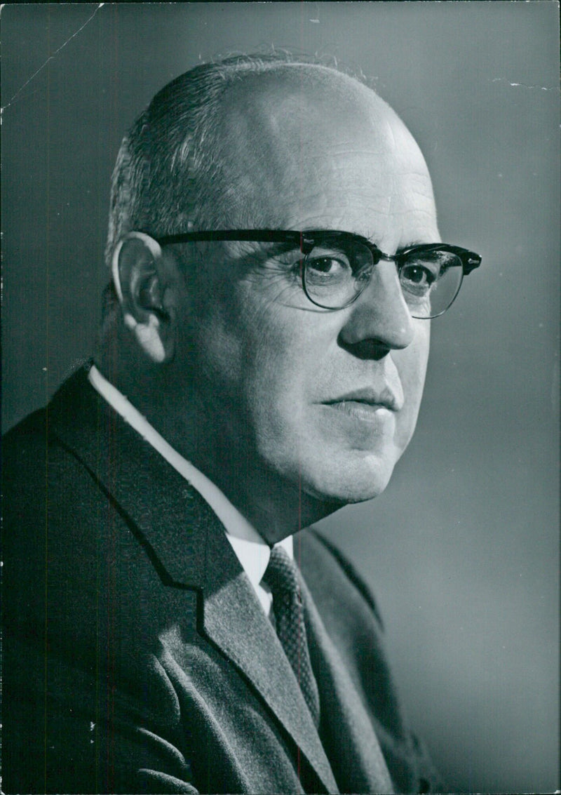 Professor Harry L. Welsh, a Fellow of the Royal Society, stands in his office at the University of Toronto. - Vintage Photograph